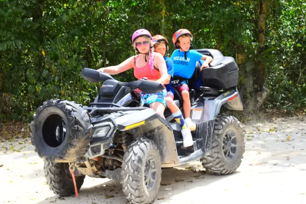 ATV rider exploring Cancun's jungle, followed by a refreshing cenote swim.