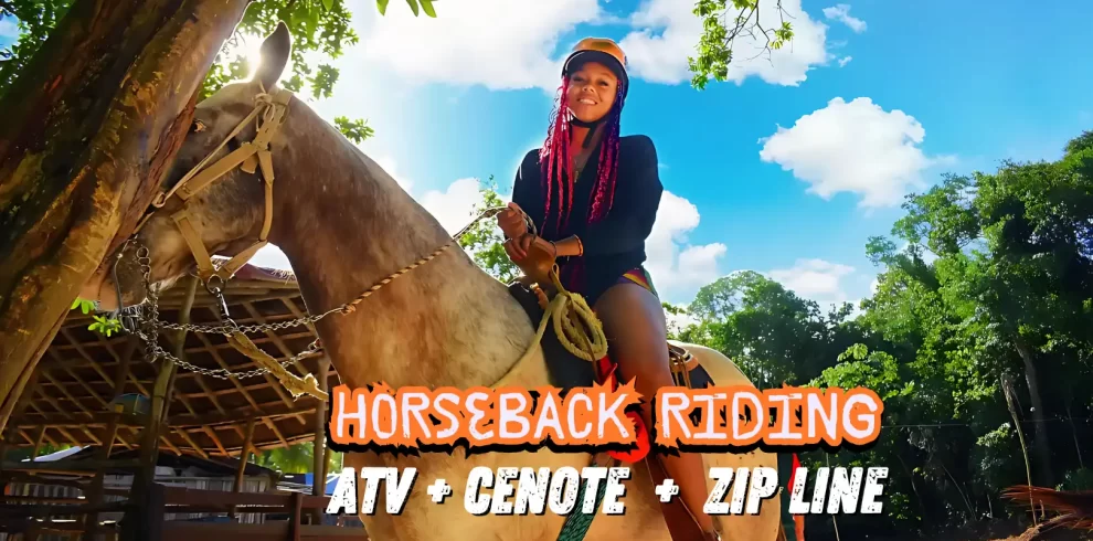 Woman smiling while riding a horse under a bright blue sky as part of a horseback riding tour.