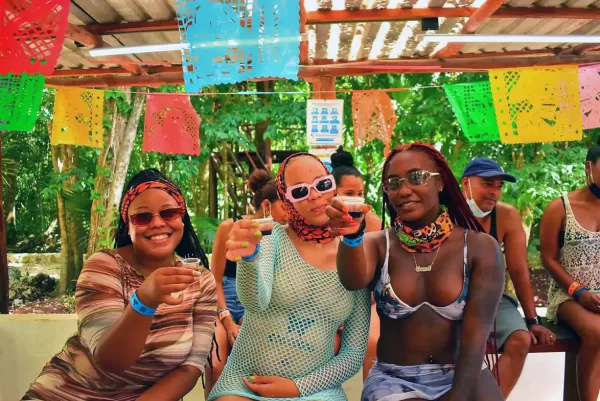Group of women enjoying a tequila tasting in the jungle.