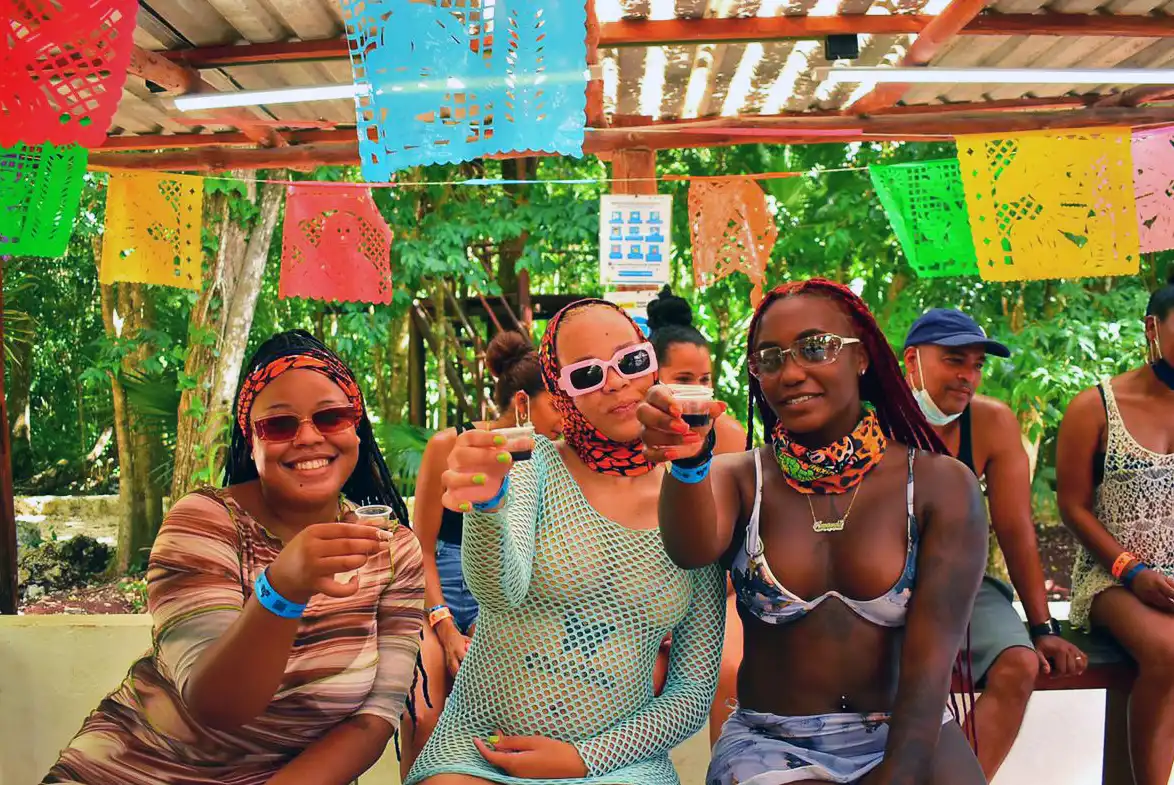 Group of women enjoying a tequila tasting in the jungle.